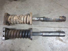 how to remove skid steer track with bad recoil spring|t250 track tensioner spring repair.